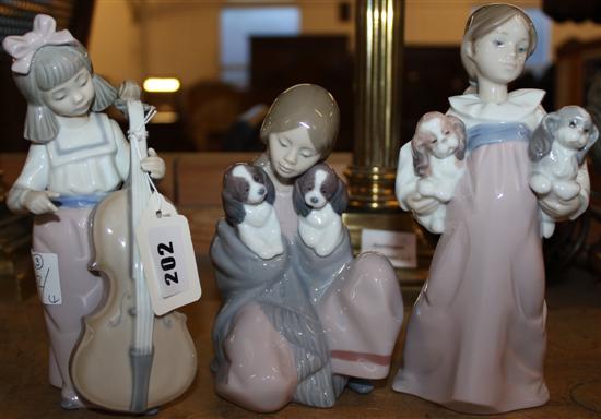 3 Lladro figurines - 2 with puppies & another with cello